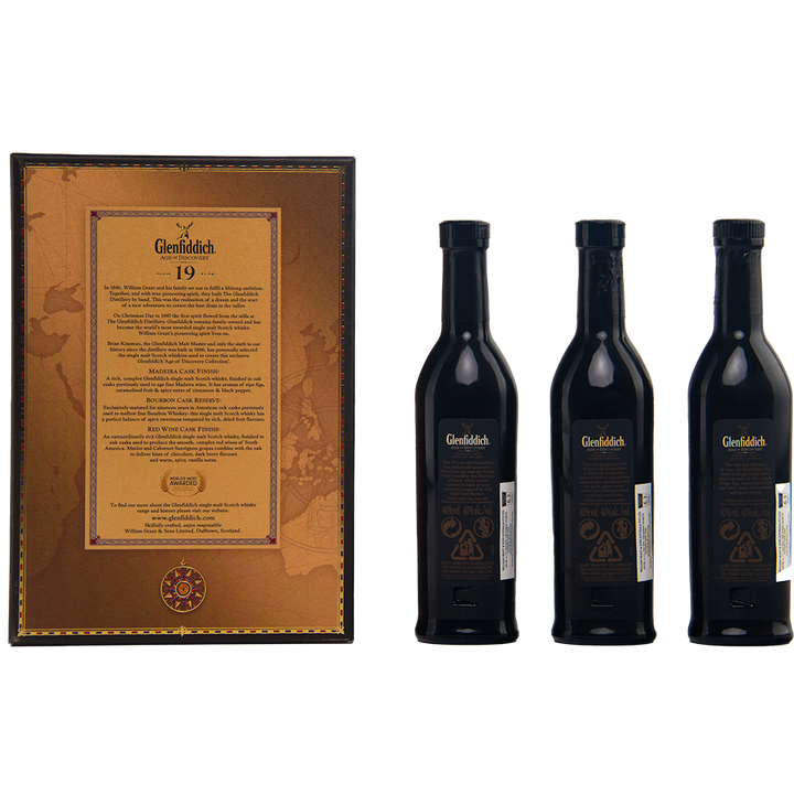 Three Glenfiddich Age of Discovery Single Malt Scotch Whisky bottles (3 x 200ml) are displayed beside a gift pack box with detailed text and a map design. Each bottle features the classic dark glass and gold label.