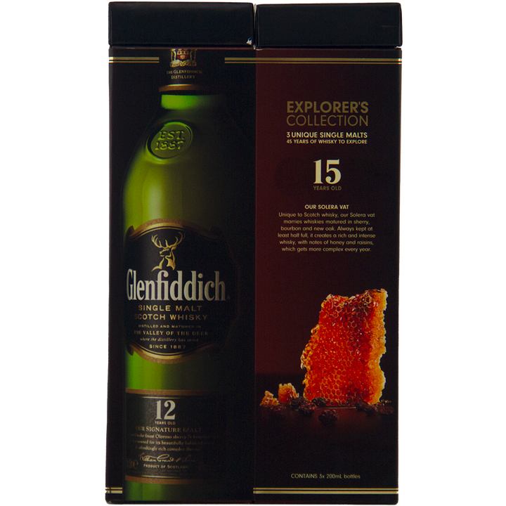 A dark box displays Glenfiddich Explorers Collection Single Malt Scotch Whisky 200ml, showing a bottle image on the left and details about 15-year-old Speyside whisky on the right, next to an amber crystal.