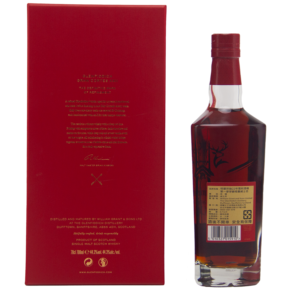 A bottle of Glenfiddich Gran Cortes XXII Single Malt Scotch Whisky stands next to a striking red box with Asian characters. This limited edition features a stag illustration and is finished in rare Palo Cortado casks.