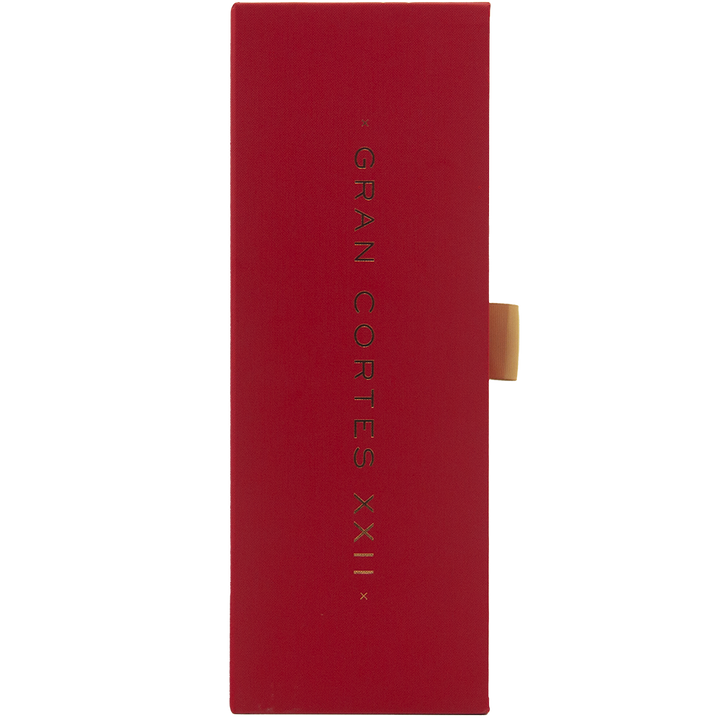 A tall, rectangular red box with gold text reading Glenfiddich Gran Cortes XXII Single Malt Scotch Whisky, a 22 Year Old finished in Palo Cortado casks, displayed vertically in the center with a gold tab on the right.