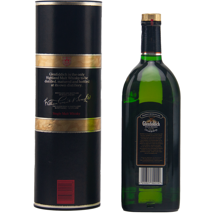 The Glenfiddich Pure Malt Whisky Single Malt Scotch Whisky 1125ml is a vintage collectible, pictured with its black and gold cylindrical packaging, both featuring brand labels against a plain white background.