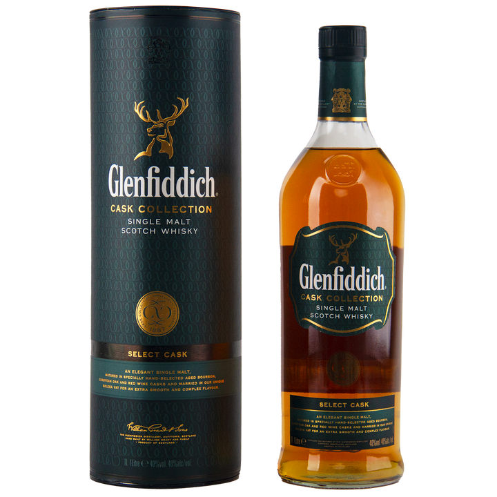 A bottle of Glenfiddich Cask Collection Select Cask Single Malt Scotch Whisky stands beside its tall green-and-gold cylindrical packaging, both adorned with a stag logo and refined branding in this travel-retail exclusive.