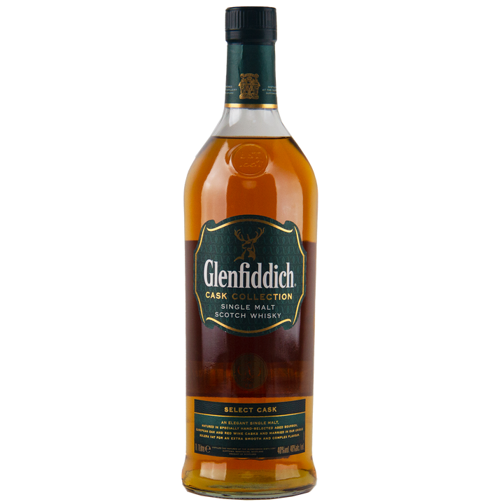 A travel-retail exclusive, Glenfiddich Cask Collection Select Cask Single Malt Scotch Whisky features a green and gold label, black cap, and displays its amber liquid in the bottle.