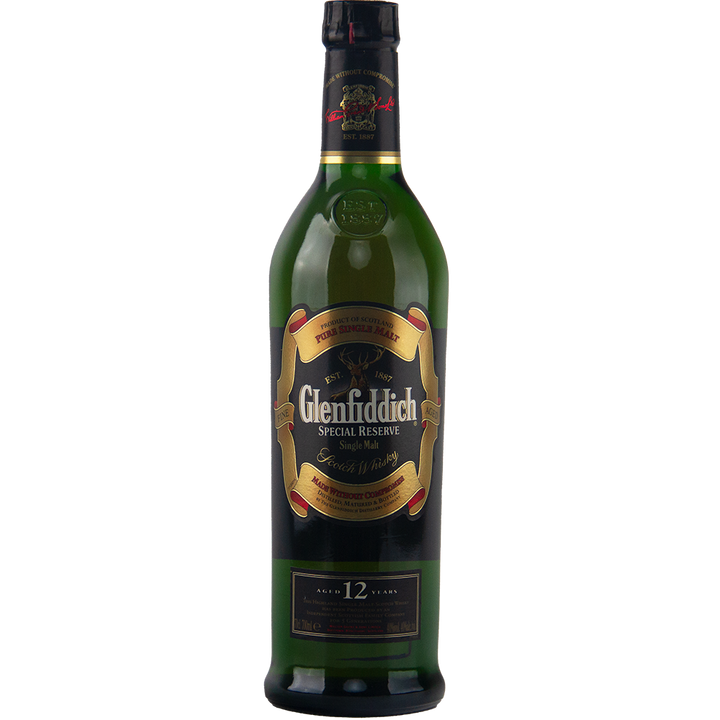A green bottle of Glenfiddich 12 Year Old Special Reserve Single Malt Scotch Whisky, featuring a black and gold label and red cap seal, stands against a plain white background.