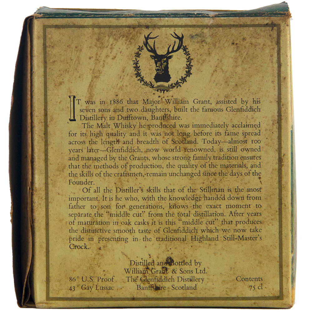 A close-up of the Glenfiddich 8 Year Old Still Master’s Crock Decanter 1970 Single Malt Scotch Whisky box, showing the distillery's history, stag head logo, and details on proof, volume, and origin at the bottom.
