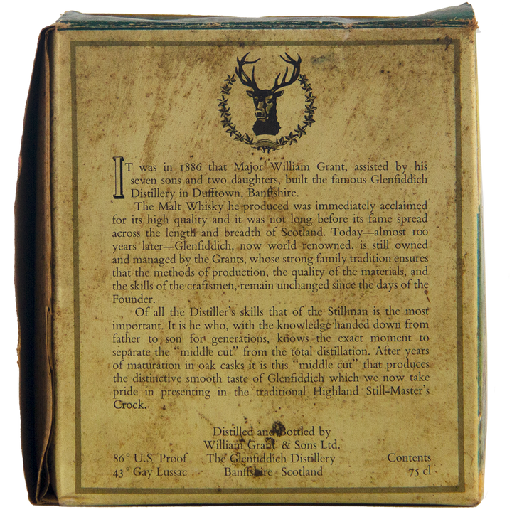 A close-up of the Glenfiddich 8 Year Old Still Master’s Crock Decanter 1970 Single Malt Scotch Whisky box, showing the distillery's history, stag head logo, and details on proof, volume, and origin at the bottom.