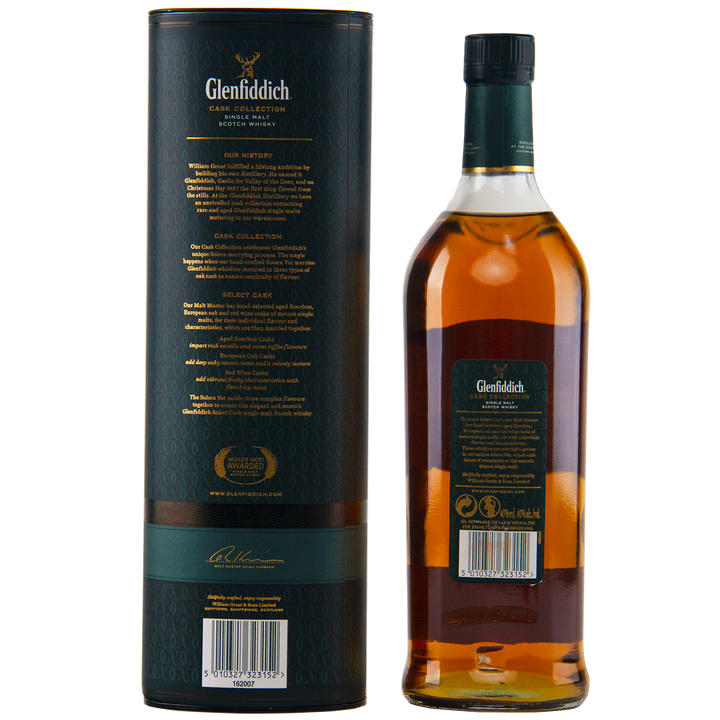 A bottle of Glenfiddich Select Cask Single Malt Scotch Whisky is displayed beside its dark green cylindrical packaging, both featuring detailed product information in gold and white text.