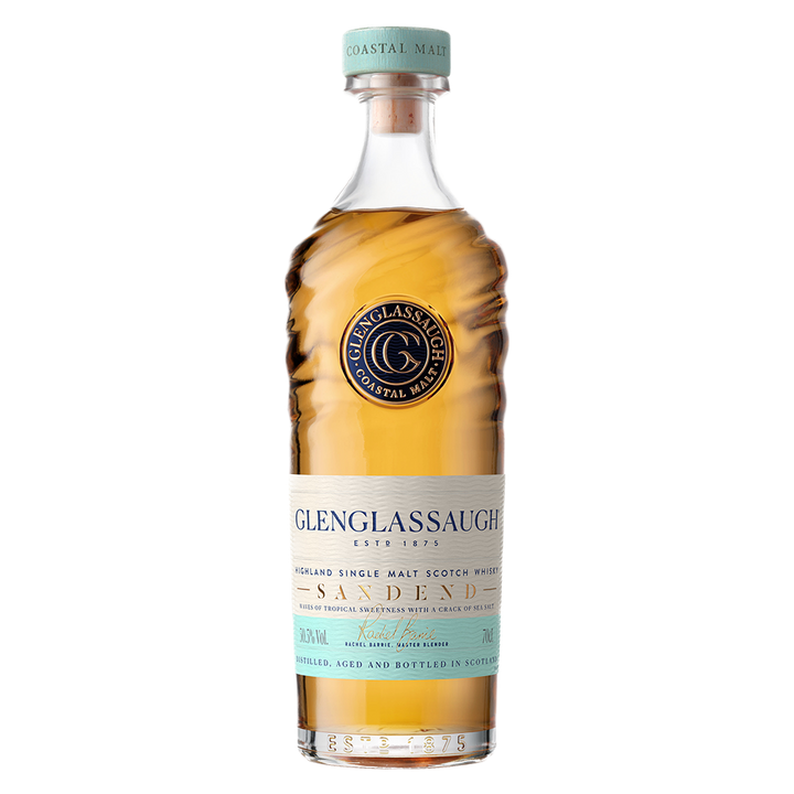 A bottle of Glenglassaugh Sandend Single Malt Scotch Whisky with wavy-textured glass, a gold liquid, blue cap, and cream and blue labels displaying the brand name and single malt scotch whisky details.