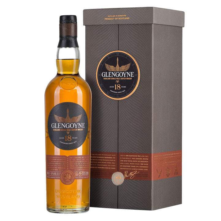 A bottle of Glengoyne 18 Year Old Single Malt Whisky stands beside its grey and copper-toned box, both displaying the Glengoyne logo and details, emphasizing its celebrated sherry cask maturation.