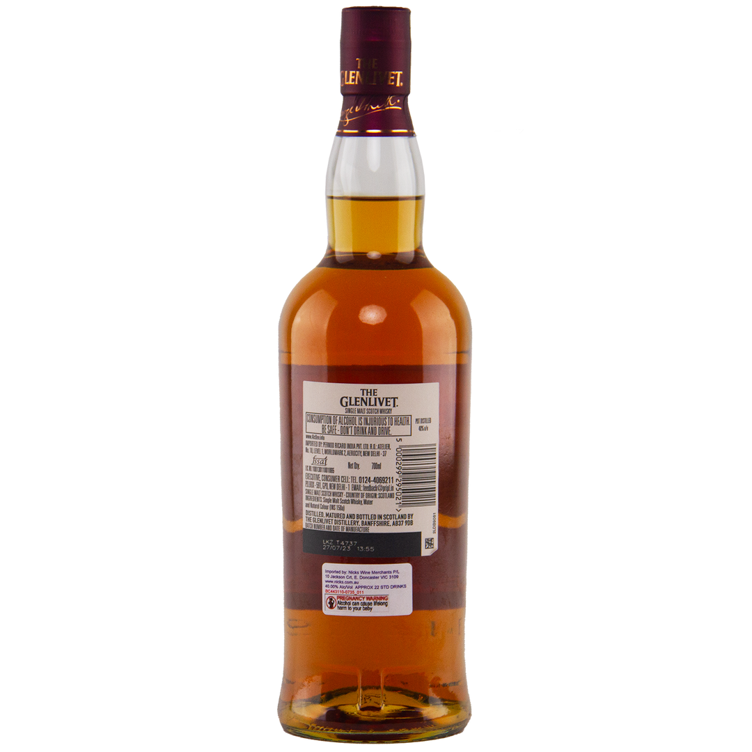 A bottle of Glenlivet 15 Year Old Single Malt Whisky is shown from the back on a white background, highlighting the label with product details and barcode.