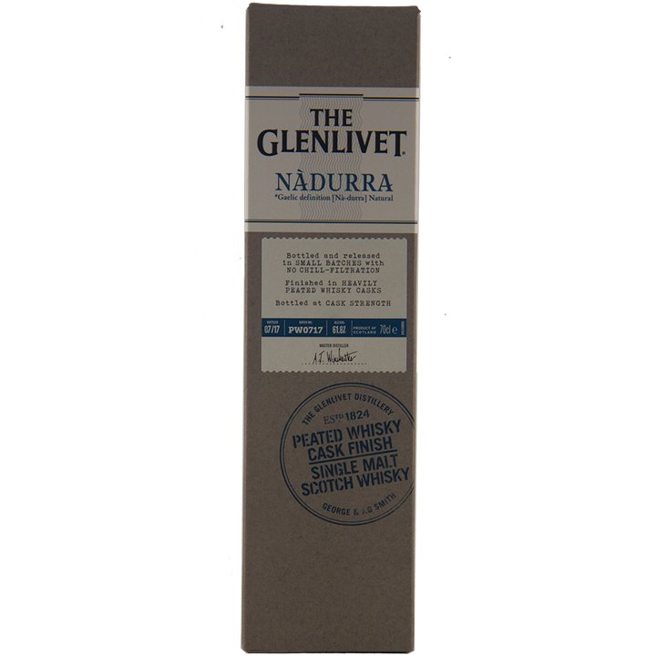 A rectangular box of Glenlivet Nadurra Peated Cask Finish single malt Scotch whisky, with gold and blue text on a beige background and a round blue stamp at the bottom.