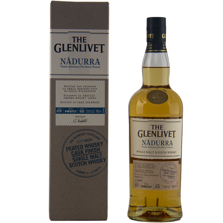 A bottle of Glenlivet Nadurra Peated Cask Finish single malt Scotch whisky stands beside its beige and gray box, both displaying the brand's logo and product details in dark blue and black. This non-chill-filtered whisky offers a peated finish.