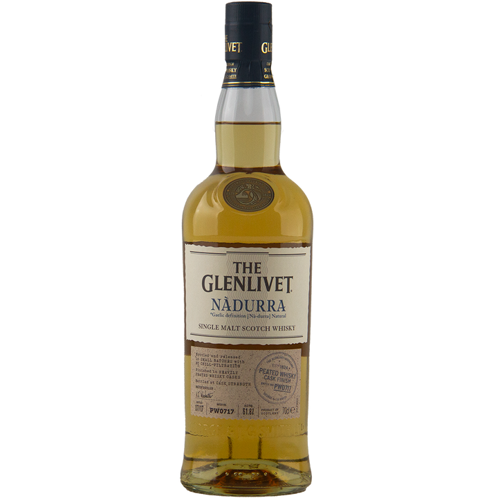 A bottle of Glenlivet Nadurra Peated Cask Finish single malt Scotch whisky with a cream label, gold accents, and dark cap is displayed against a plain white background.