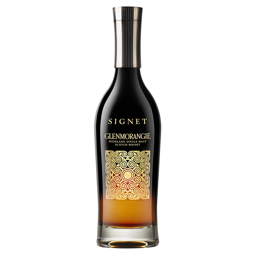 A bottle of Glenmorangie Signet Single Malt Scotch Whisky, featuring a black and gold label with ornate swirls and a metallic cap, is displayed against a white background.