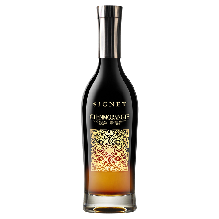 A bottle of Glenmorangie Signet Single Malt Scotch Whisky, featuring a black and gold label with ornate swirls and a metallic cap, is displayed against a white background.