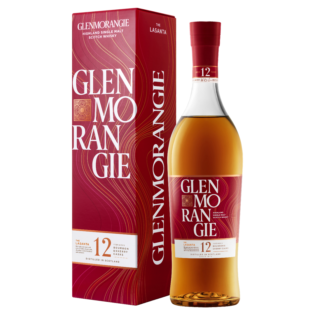 A bottle of Glenmorangie 12 Year Old Lasanta Single Malt Scotch Whisky stands beside its coordinating red and gold box, both adorned with white and gold text and elegant swirling designs.