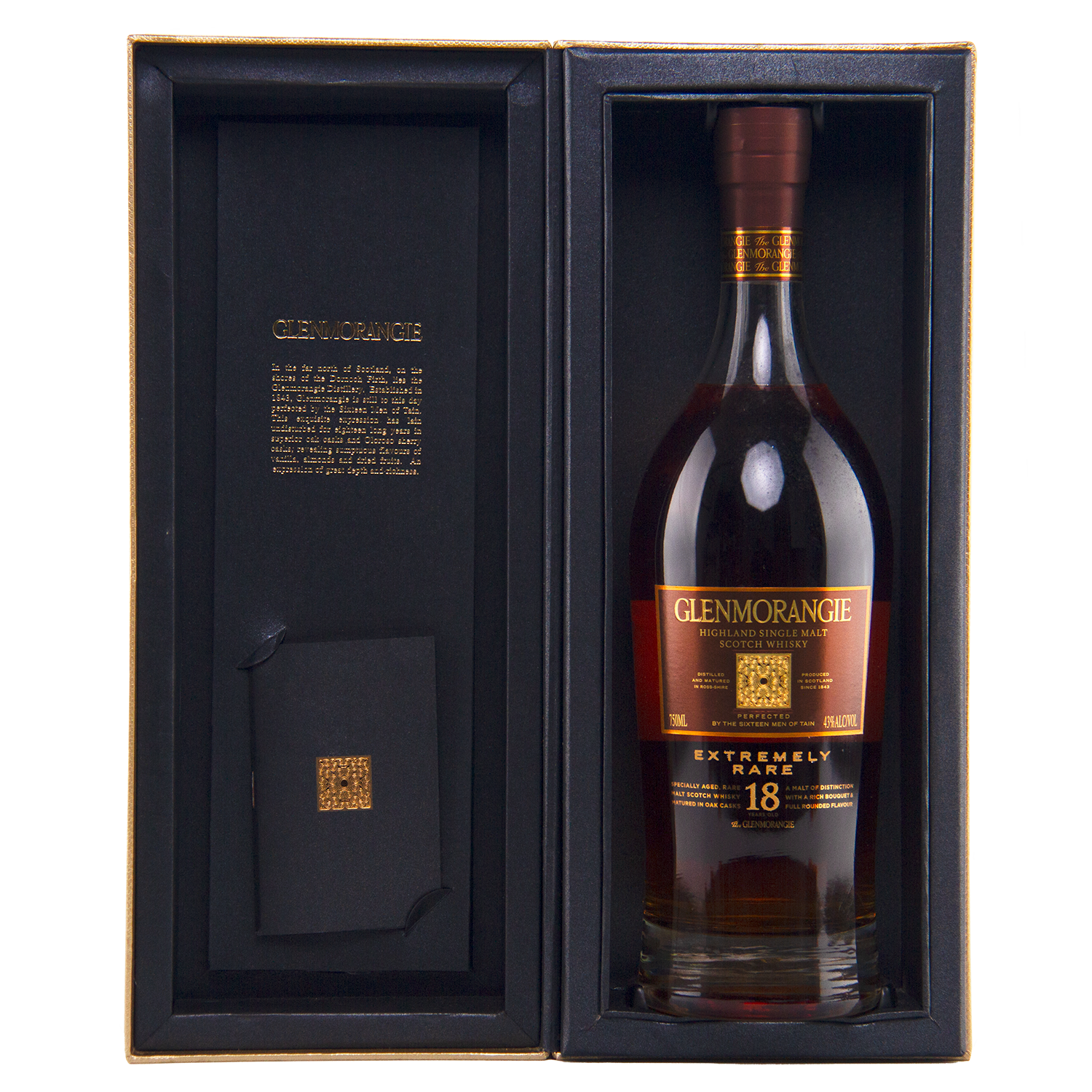 A bottle of Glenmorangie 18 Year Old Extremely Rare (Older Packaging) Highland single malt Scotch whisky displayed in an open black gift box with gold detailing and an inscription inside the cover.