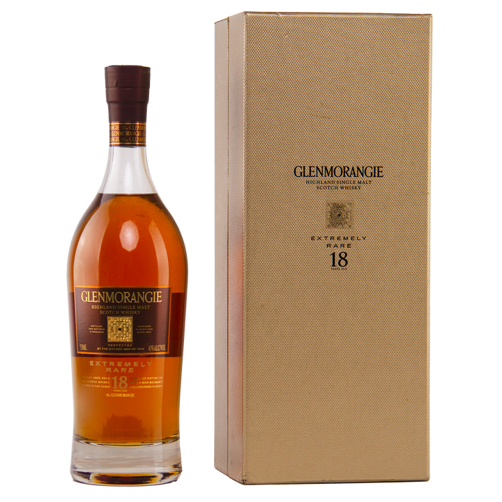 A bottle of Glenmorangie 18 Year Old Extremely Rare (Older Packaging) stands beside its gold, textured box with matching label and black text, highlighting this exceptional Highland single malt Scotch whisky.
