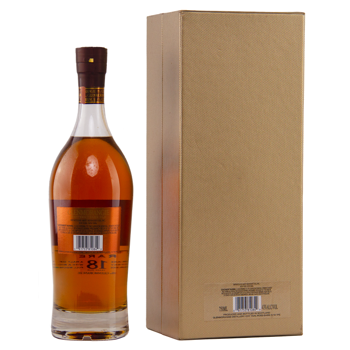 A bottle of Glenmorangie 18 Year Old Extremely Rare (Older Packaging) with a brown cap stands next to a tall, gold textured box. Both display barcode labels, set against a plain white background.