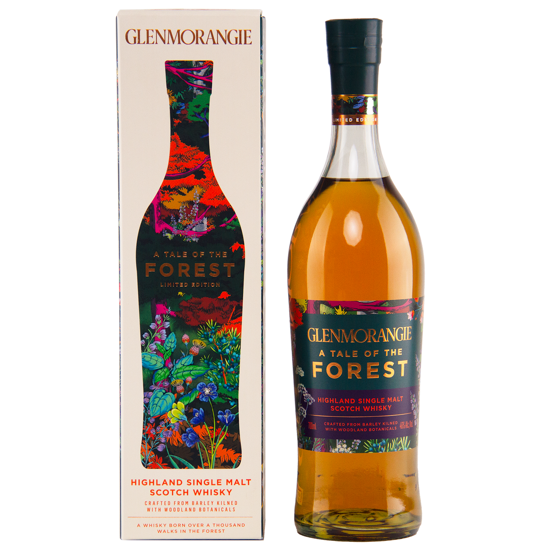 A bottle of Glenmorangie A Tale of Forest Limited Edition sits next to its vibrant, nature-inspired box adorned with colorful plant and forest designs, reflecting the woodland adventure captured in this unique botanical whisky.