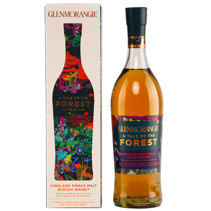 A bottle of Glenmorangie A Tale of Forest Limited Edition sits next to its vibrant, nature-inspired box adorned with colorful plant and forest designs, reflecting the woodland adventure captured in this unique botanical whisky.