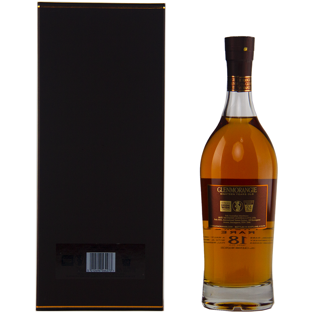 A bottle of Glenmorangie Extremely Rare 18 Year Old Single Malt Whisky stands beside its tall, rectangular black box with gold accents and a barcode on the lower back.