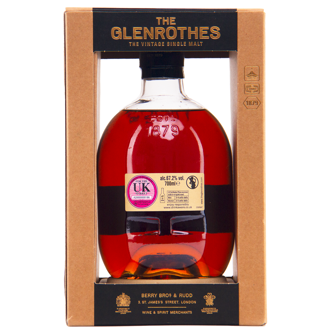 A bottle of Glenrothes #5454 Single Malt Scotch Whisky with dark amber liquid, shown in a cardboard box featuring gold and black labels, and a UK duty stamp on the bottle.