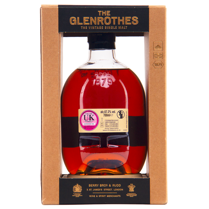 A bottle of Glenrothes #5454 Single Malt Scotch Whisky with dark amber liquid, shown in a cardboard box featuring gold and black labels, and a UK duty stamp on the bottle.