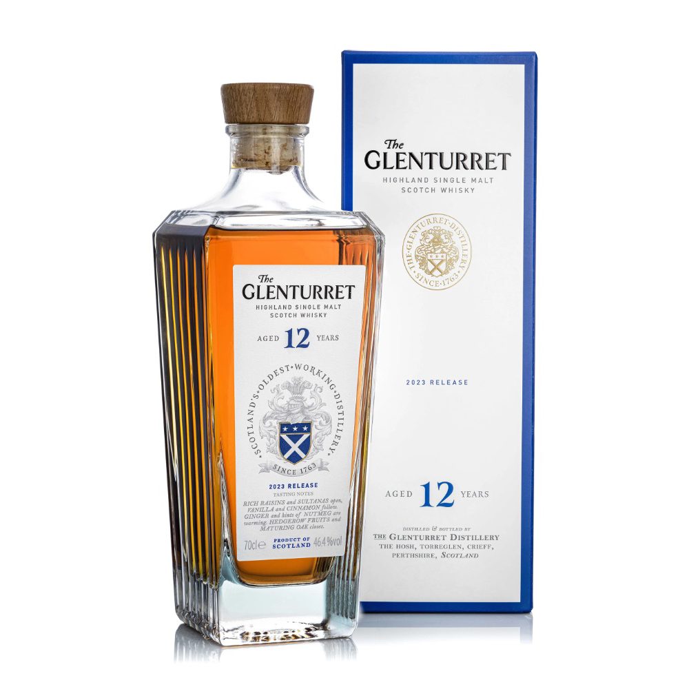 A bottle of Glenturret 12 Year Old Single Malt Scotch Whisky with a wooden cap is shown next to its blue and white box packaging, which displays the brand logo and product details.