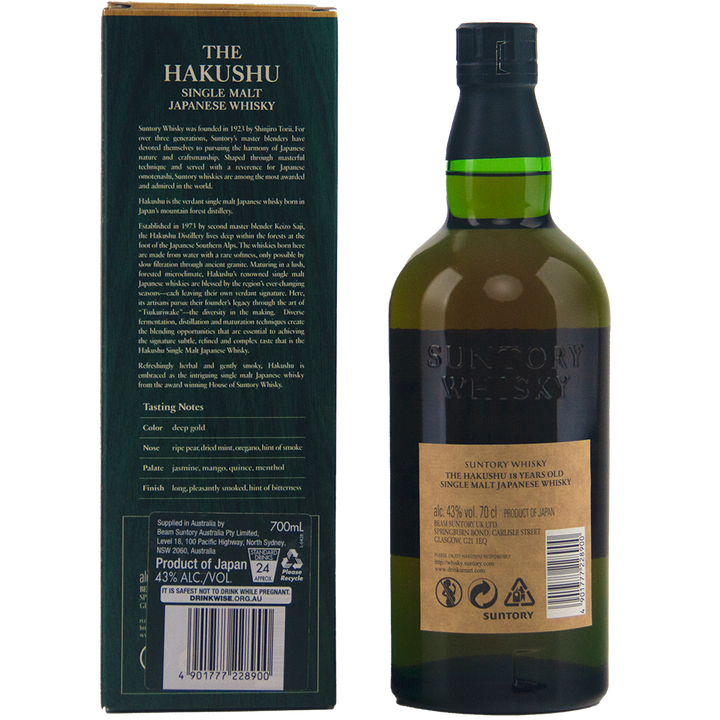 A bottle of Hakushu 18 Year Old Single Malt Whisky stands beside its green box, both featuring Suntory whisky details and Japanese characters. The dark green bottle includes a gold label and coordinating green cap.
