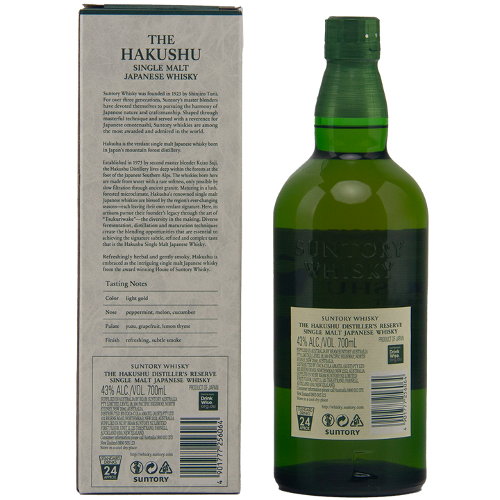 A green bottle of Hakushu Story Of The Distillery 2024 Edition whisky stands beside its box, which features detailed information and tasting notes. The bottle label indicates 43% alcohol content and a 700ml volume of this renowned Japanese single malt.