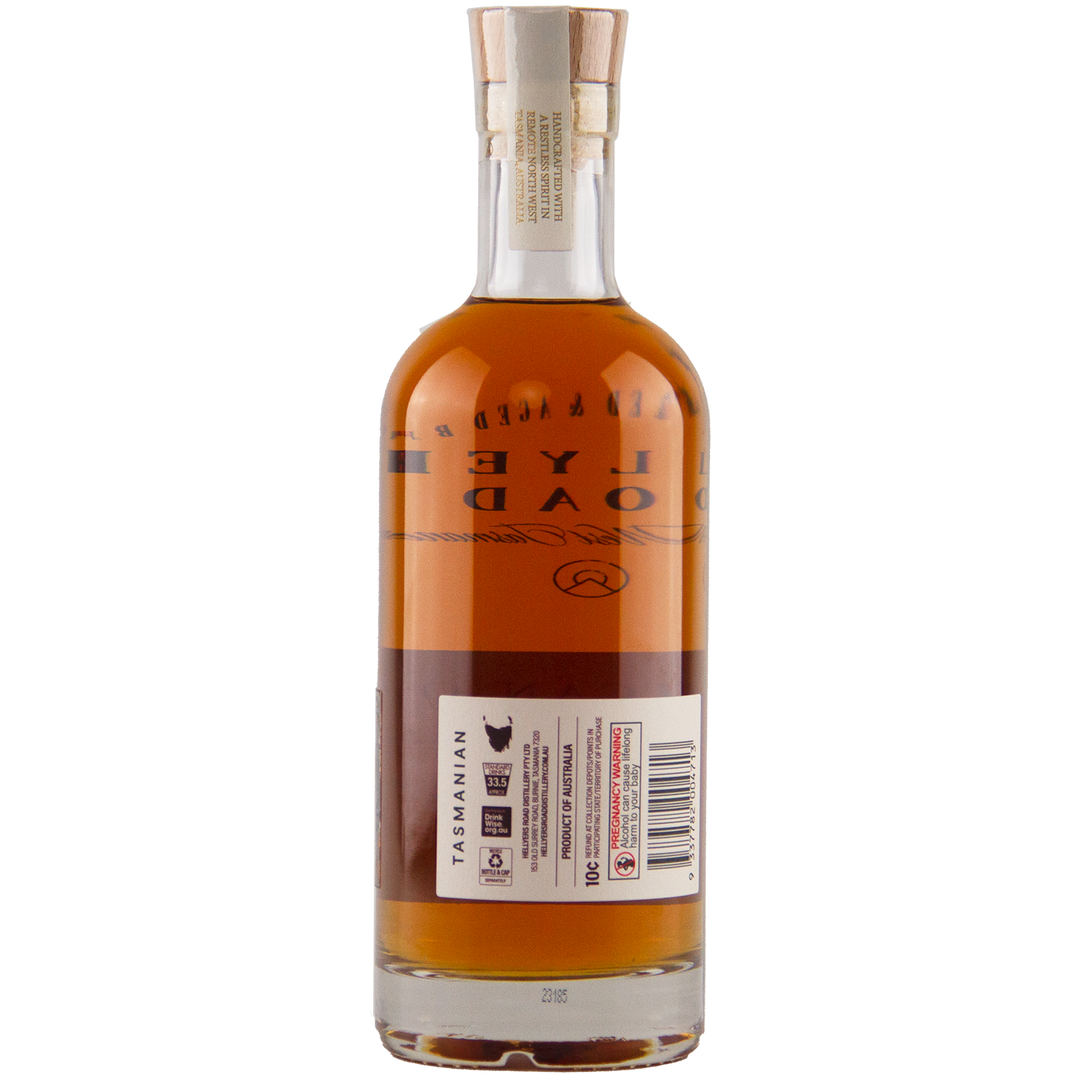 A bottle of brown liquor with a wooden cork, shown from the back. The label features text, barcodes, and a Tasmanian map with Tasmanian printed vertically—featuring Hellyers Road 16 Year Old American Oak Single Cask No. 3191.04 Australian Single Malt Whisky.