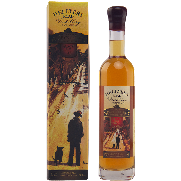 A bottle of Hellyers Road Henry's Legacy Series Black Buff Australian Single Malt Whisky stands beside its box, decorated with artwork of a man and dog walking along a golden path bordered by trees.