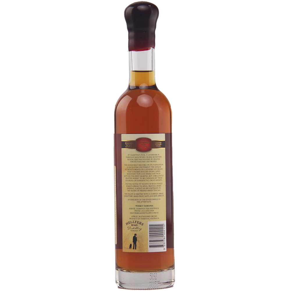 A tall bottle of amber Hellyers Road Saint Valentines Peak Australian Single Malt Whisky, capped with black wax, is shown from the back with a tan label featuring text, barcode, and a small logo at the bottom.