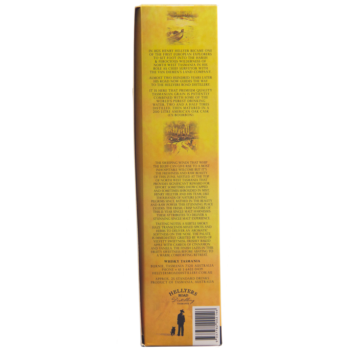 Side view of a yellow Hellyers Road Saint Valentines Peak Australian Single Malt Whisky box showing detailed printed text about this Tasmanian whisky’s history, with small illustrations and a man and dog logo in the bottom corner.