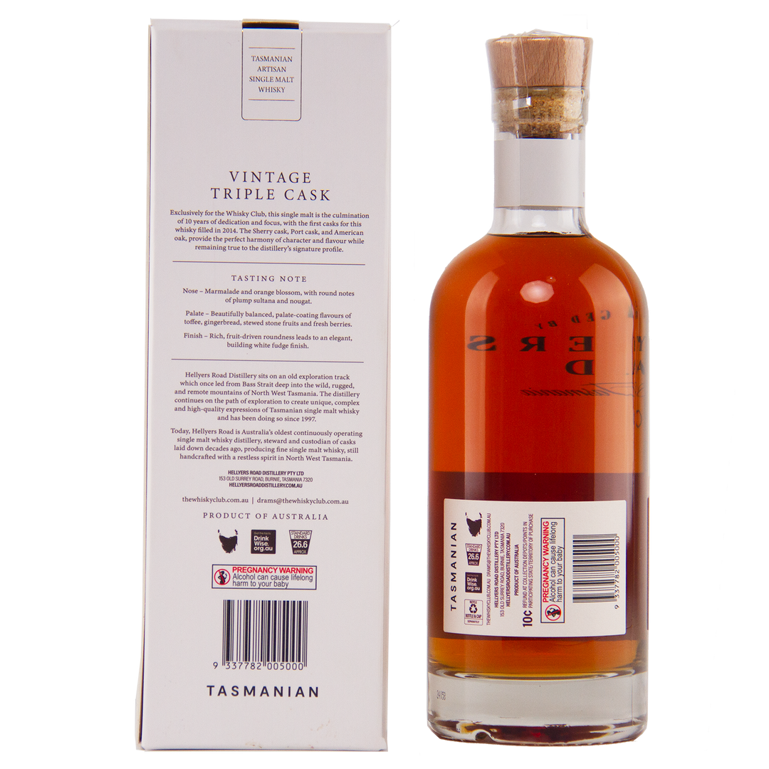 A bottle of Hellyers Road Vintage Triple Cask Australian Single Malt Whisky stands next to its box, showcasing a detailed label and cork stopper. The white box displays tasting notes and information in black, exclusive to The Whisky Club.