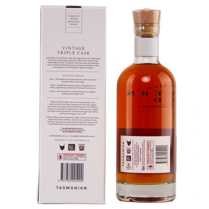 A bottle of Hellyers Road Vintage Triple Cask Australian Single Malt Whisky stands next to its box, showcasing a detailed label and cork stopper. The white box displays tasting notes and information in black, exclusive to The Whisky Club.