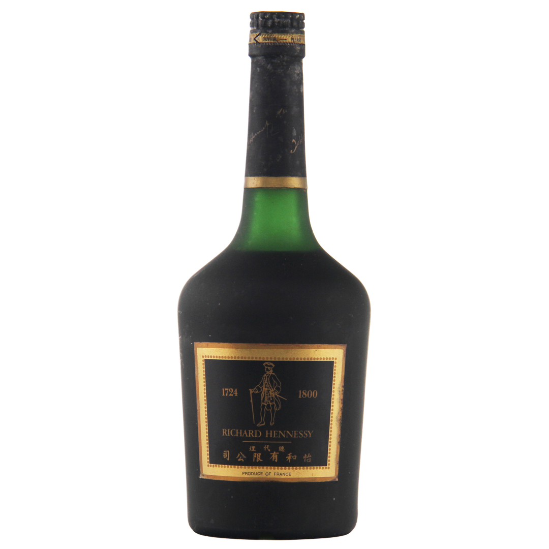 Bottle of Hennessy cognac with a black label on a white background