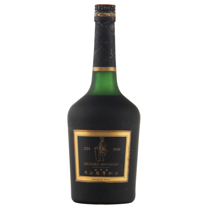Bottle of Hennessy cognac with a black label on a white background