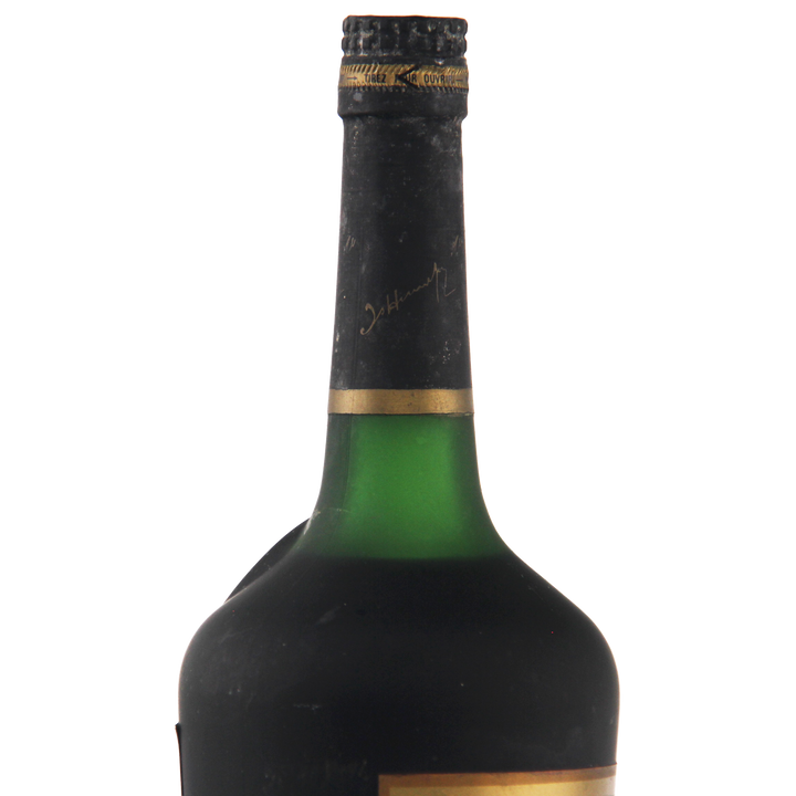 Green wine bottle with black label on a white background