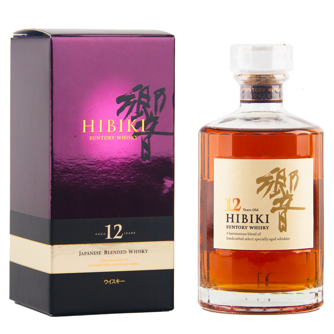 A bottle of Hibiki 12 Year Old Japanese Blended Whisky with a clear stopper stands beside its purple and gold box, both featuring Japanese characters and product details.