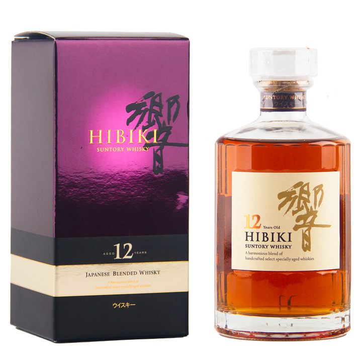 A bottle of Hibiki 12 Year Old Japanese Blended Whisky with a clear stopper stands beside its purple and gold box, both featuring Japanese characters and product details.