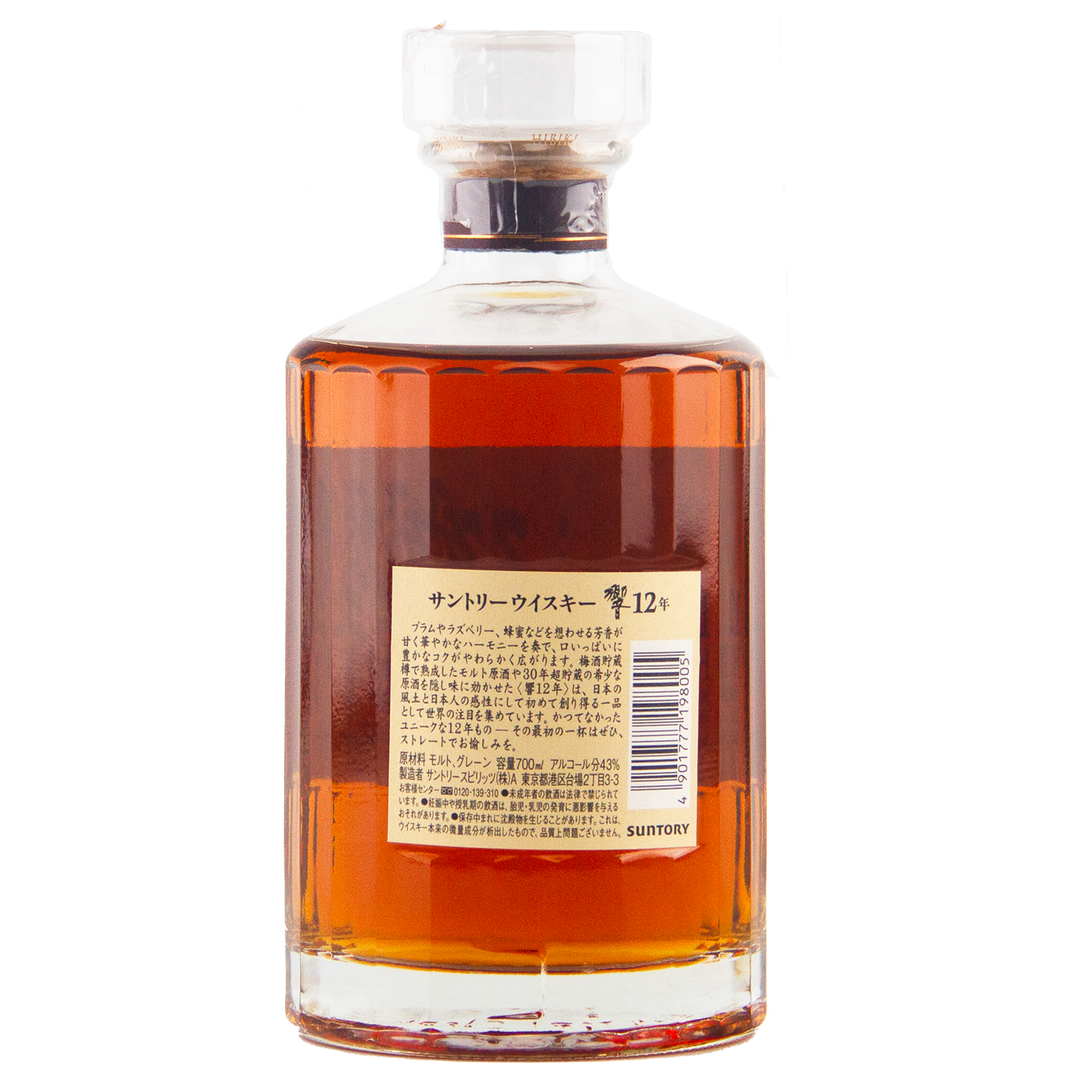 A bottle of Hibiki 12 Year Old Japanese Blended Whisky featuring amber liquid, a clear cap, and a beige label with Japanese text and a barcode, showcasing Suntory’s renowned 12-year-old release.