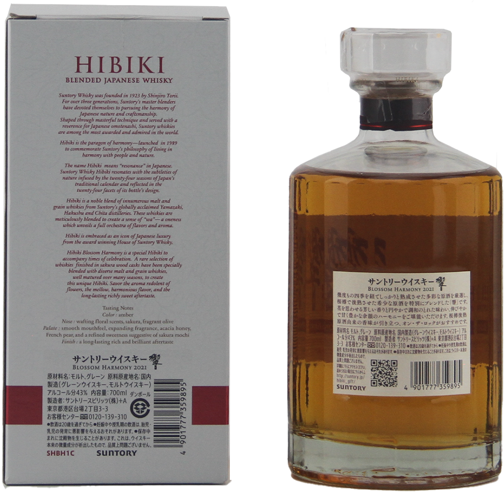 A bottle of Hibiki Blossom Harmony 2021 Japanese Blended Malt Whisky stands beside its box, featuring amber whisky in a clear, stoppered bottle and packaging that highlights this limited edition’s story and tasting notes.