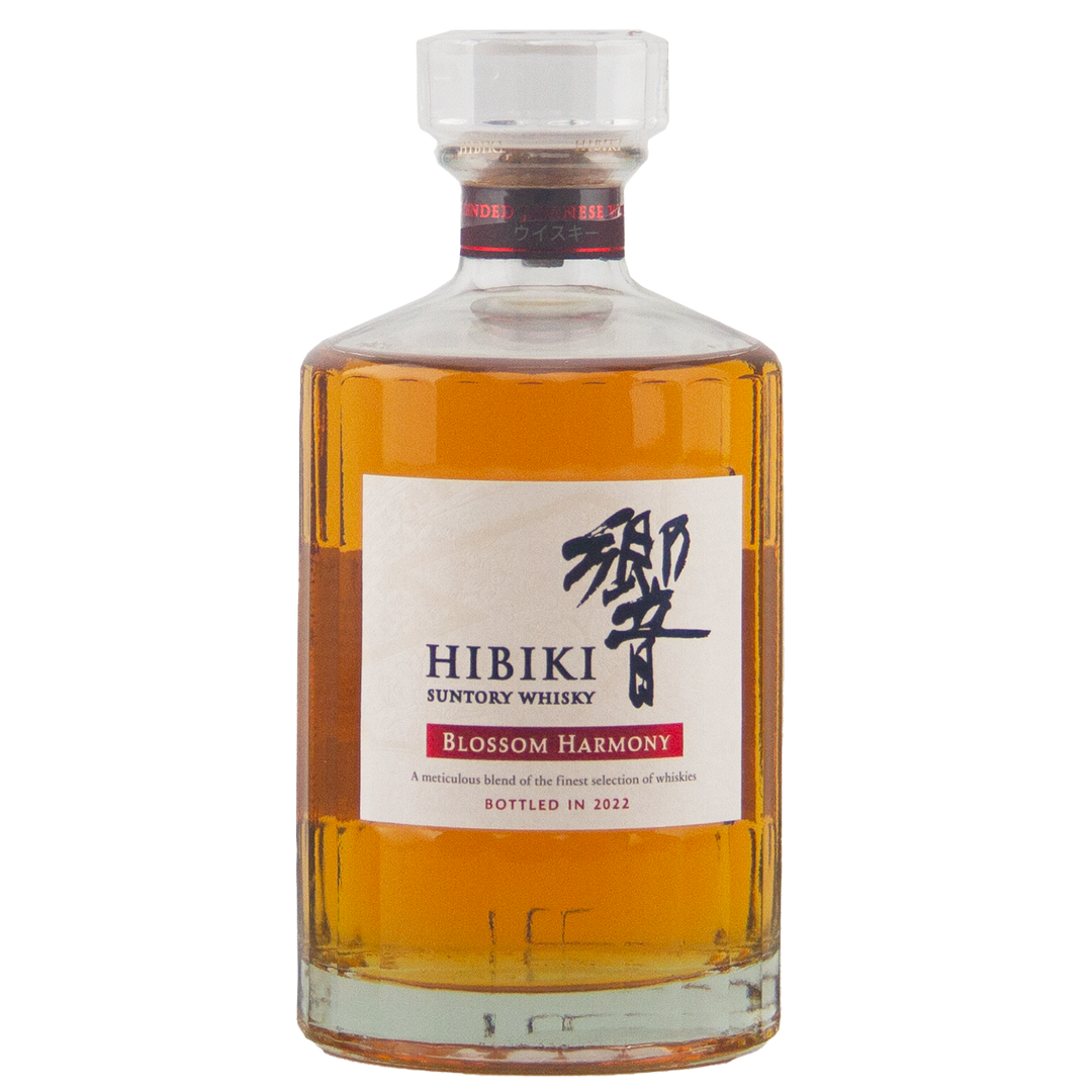 A bottle of Hibiki Blossom Harmony 2022 Limited Edition Japanese whisky, featuring amber liquid and a white label with black Japanese characters, red accents, and the year 2022 noted.