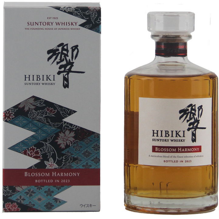 A bottle of Hibiki Blossom Harmony 2023 Japanese Blended Malt Whisky stands next to its floral-patterned box adorned with Japanese text.