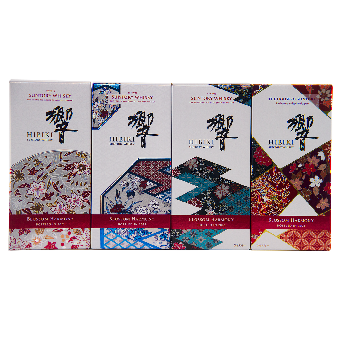 The Hibiki Blossom Harmony Limited Edition Collection 2021 to 2024 features four decorative boxes, each with distinct floral and geometric Japanese designs in red, blue, teal, and gold accents, displayed side by side.