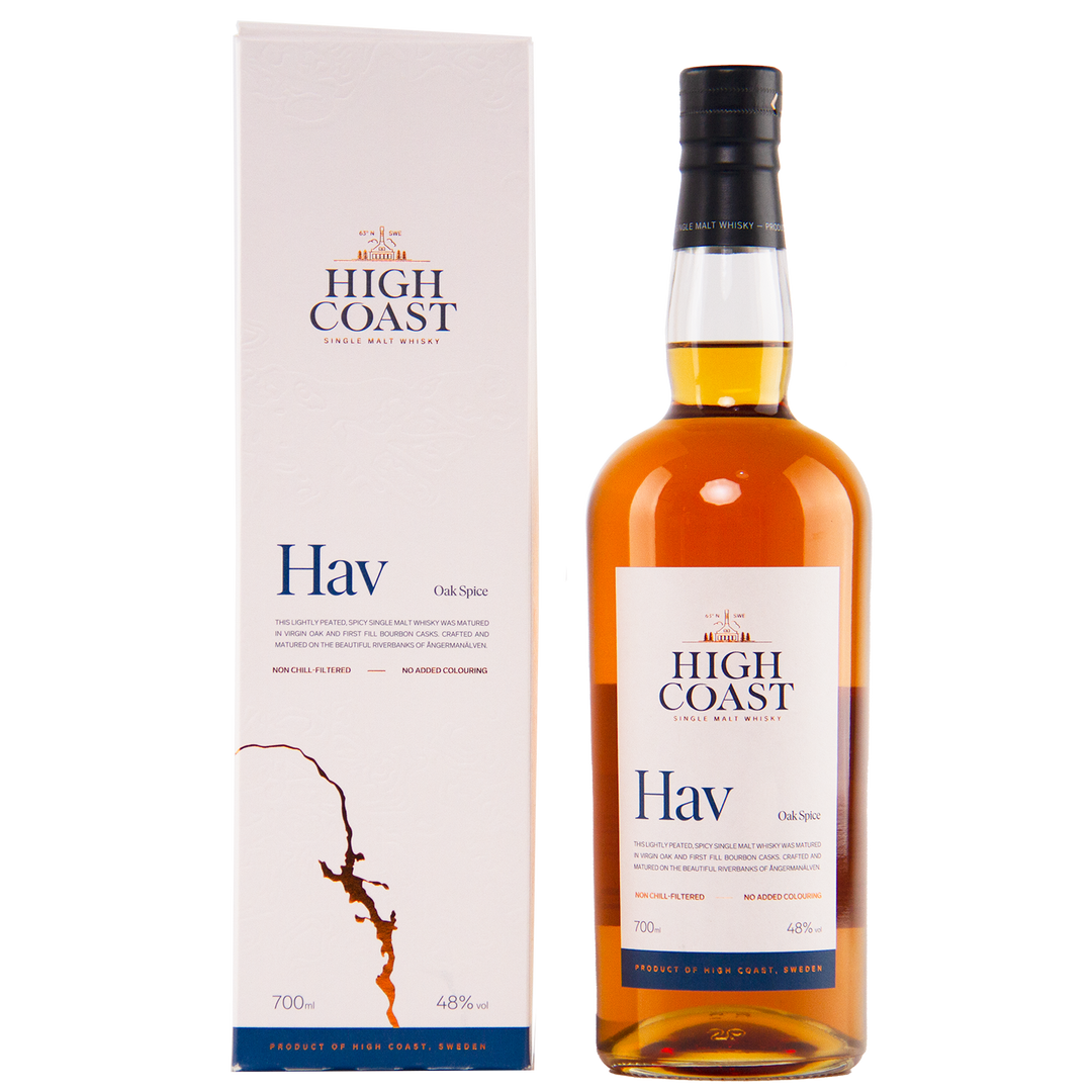 A bottle of High Coast Hav Single Malt Swedish Whisky stands beside its white box, both adorned with blue and gold text and a map outline. The bottle holds amber whisky matured in oak casks.