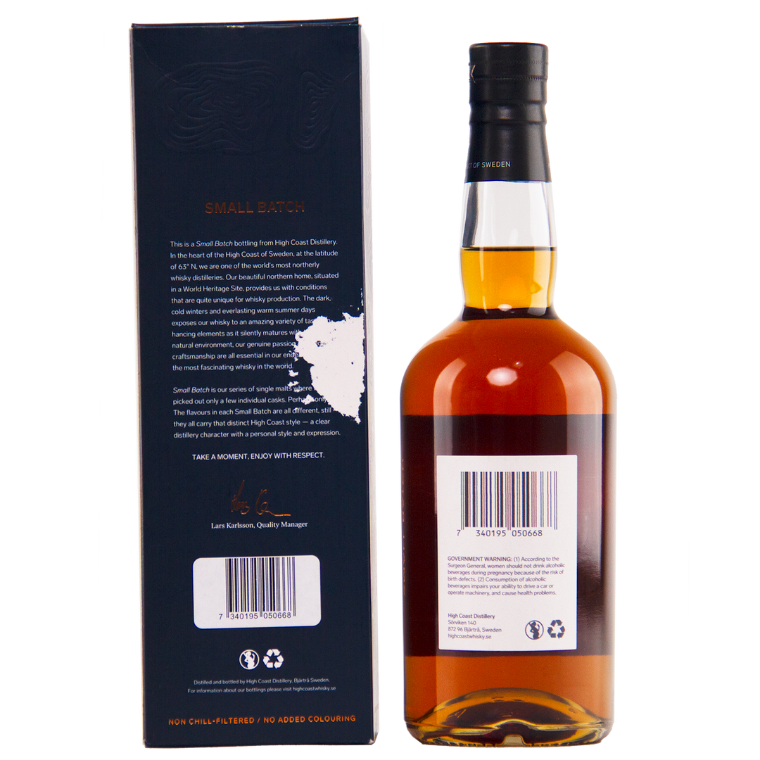 Whiskey bottle with label and box on a white background