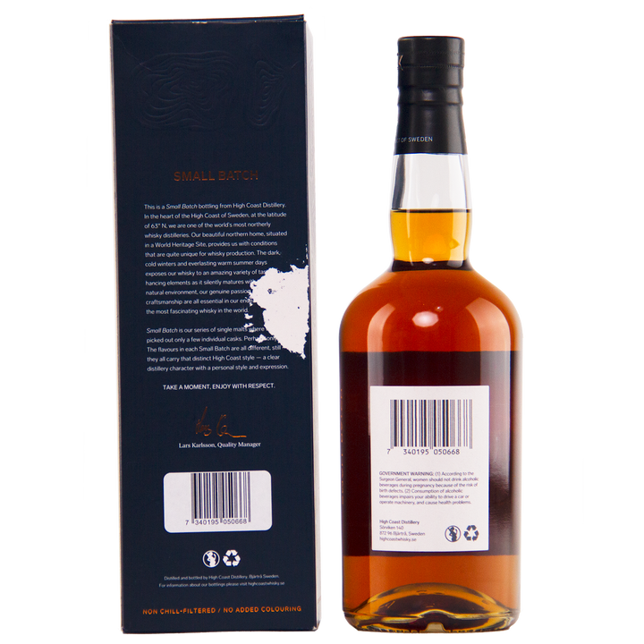 Whiskey bottle with label and box on a white background